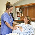Woman in a labor and delivery suite preparing for birth